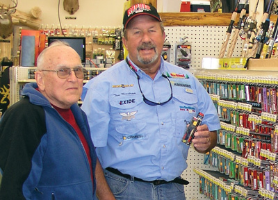 Professional Fishing Guide Tom Neustrom suggests a Rapala Crankbait to a customer at L&M Supply in Grand Rapids, Minnesota.